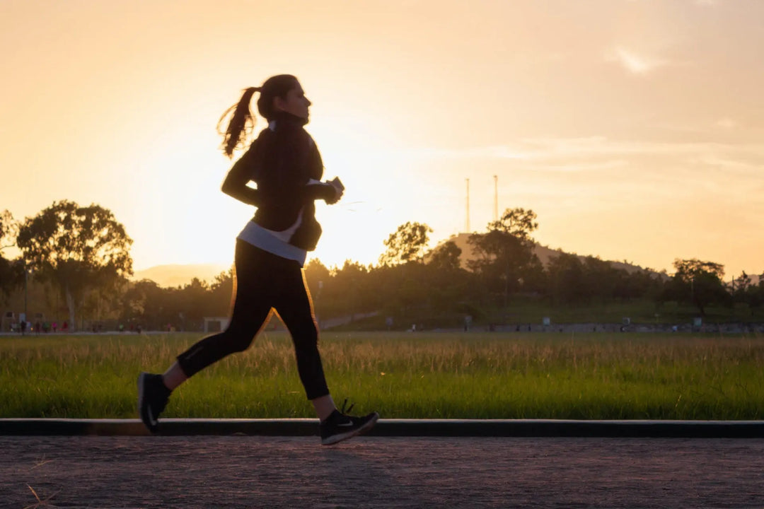 Person jogging outdoors to improve mental and physical health.